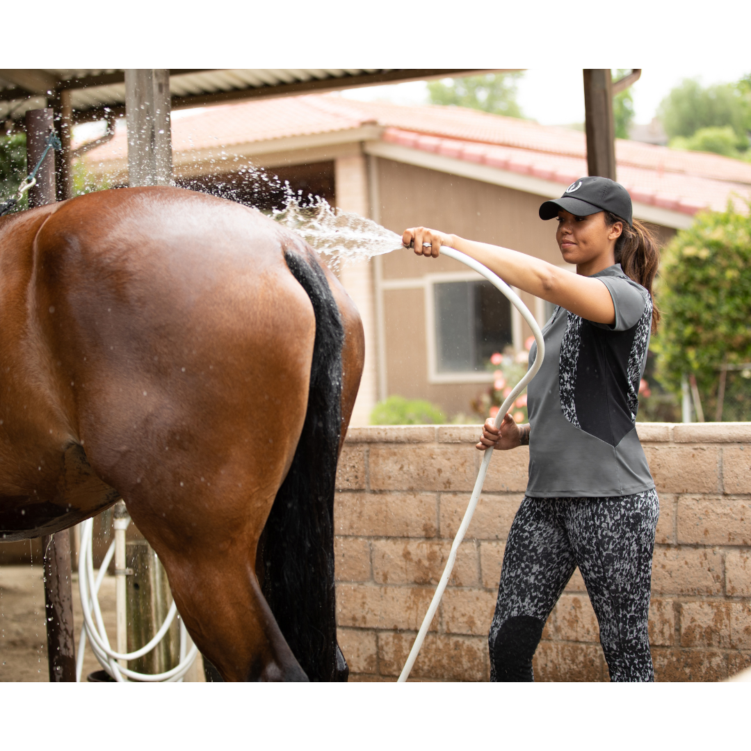 Kerrits Close Contact Riding Shirt on Rider Washing Horse