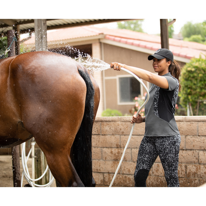 Kerrits Close Contact Riding Shirt on Rider Washing Horse